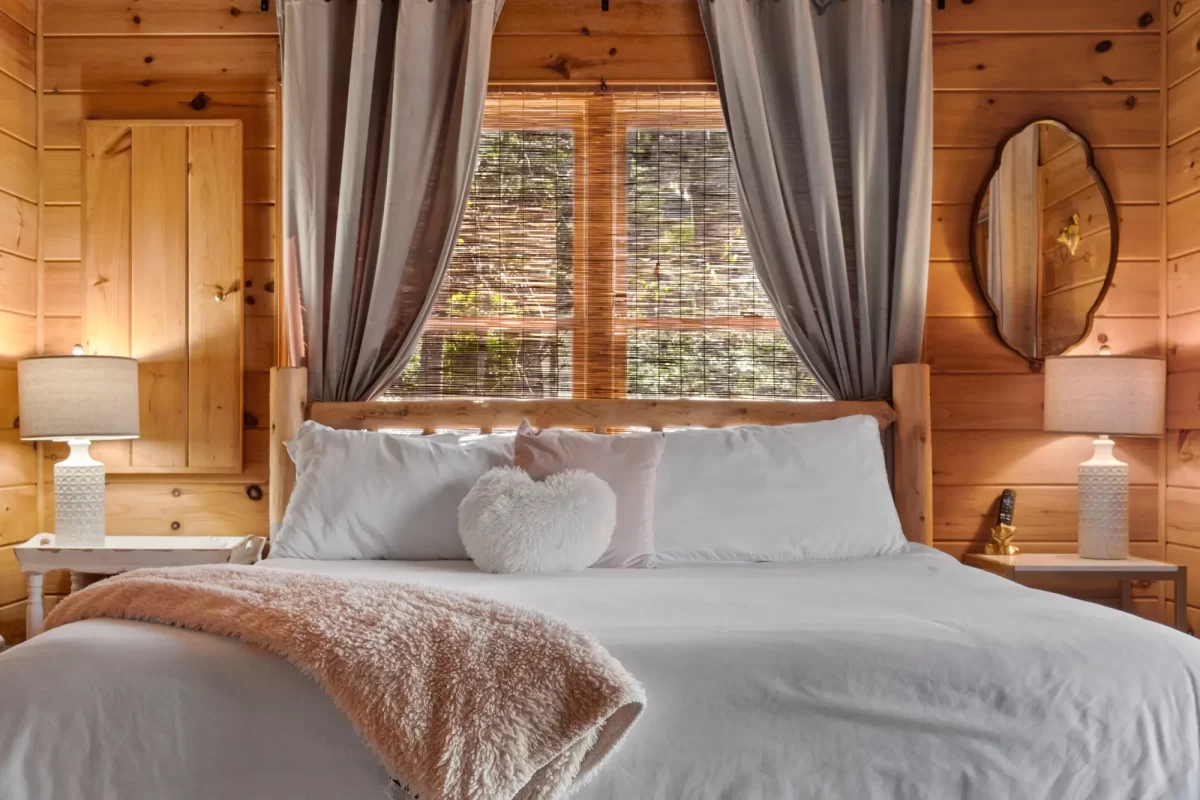 Romantic master bedroom decor in Blake's on the Creek cabin.