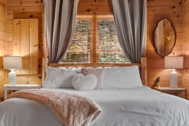 Romantic master bedroom decor in Blake's on the Creek cabin.