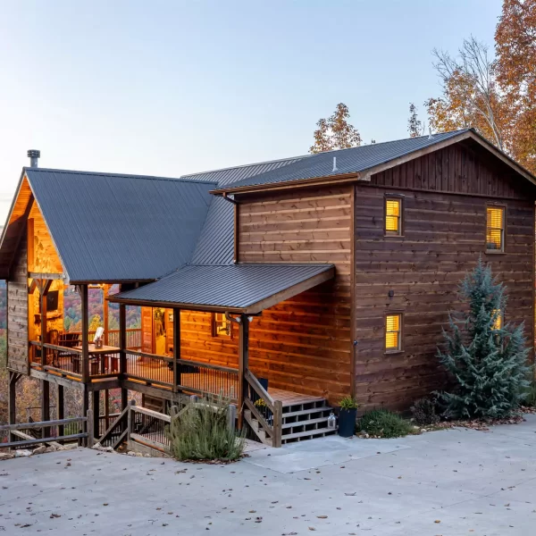 A side view of a Stay and Play cabin before sunset.