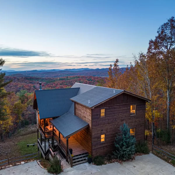 An elevated view of a Stay and Play cabin before sunset.